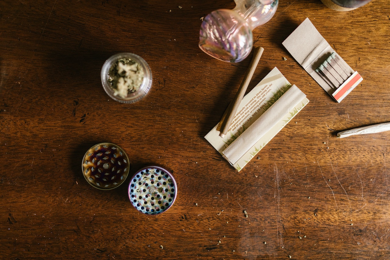 Weed Paraphernalia on Top of Wooden Table