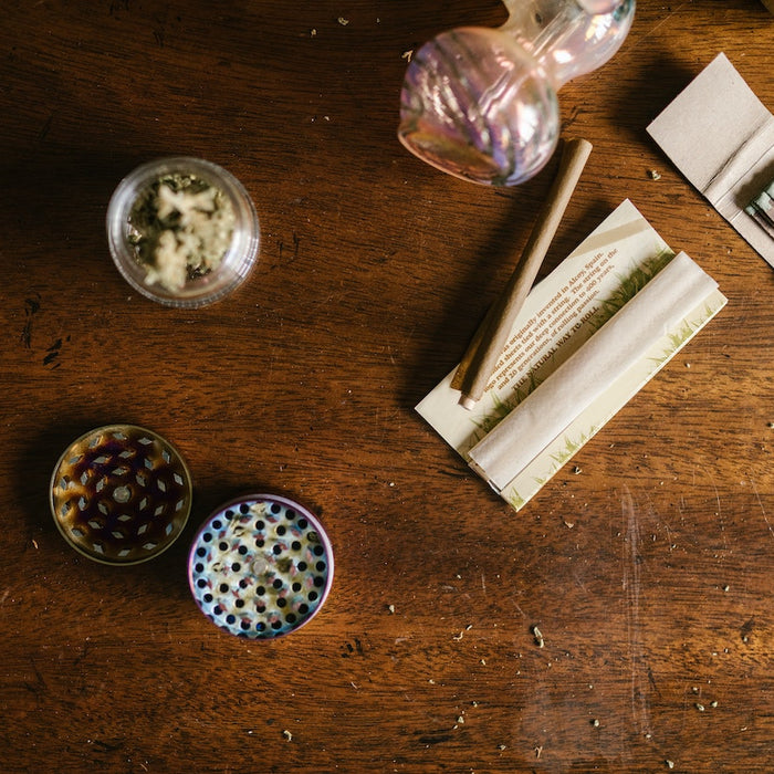 Weed Paraphernalia on Top of Wooden Table